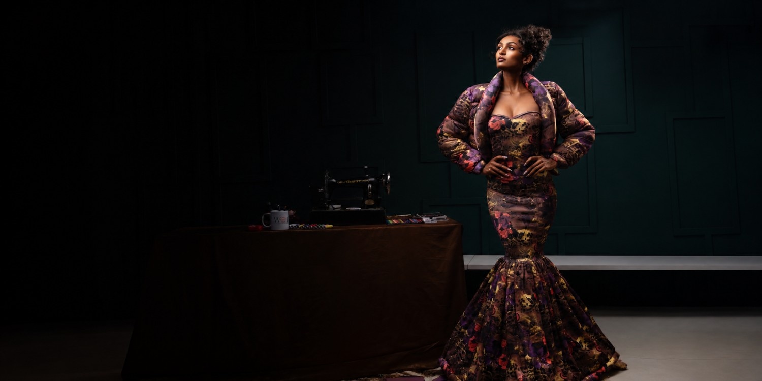 Model wearing the Sculptural couture gown against a dark studio backdrop